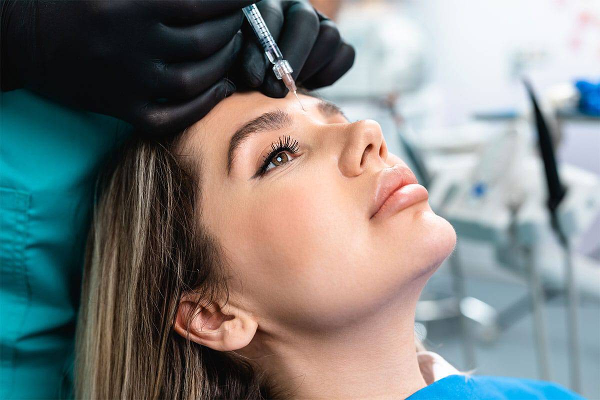 Botox Young Woman Getting Botox Injection on Forhead | LA Ageless Medical Aesthetics in Beverly Hills