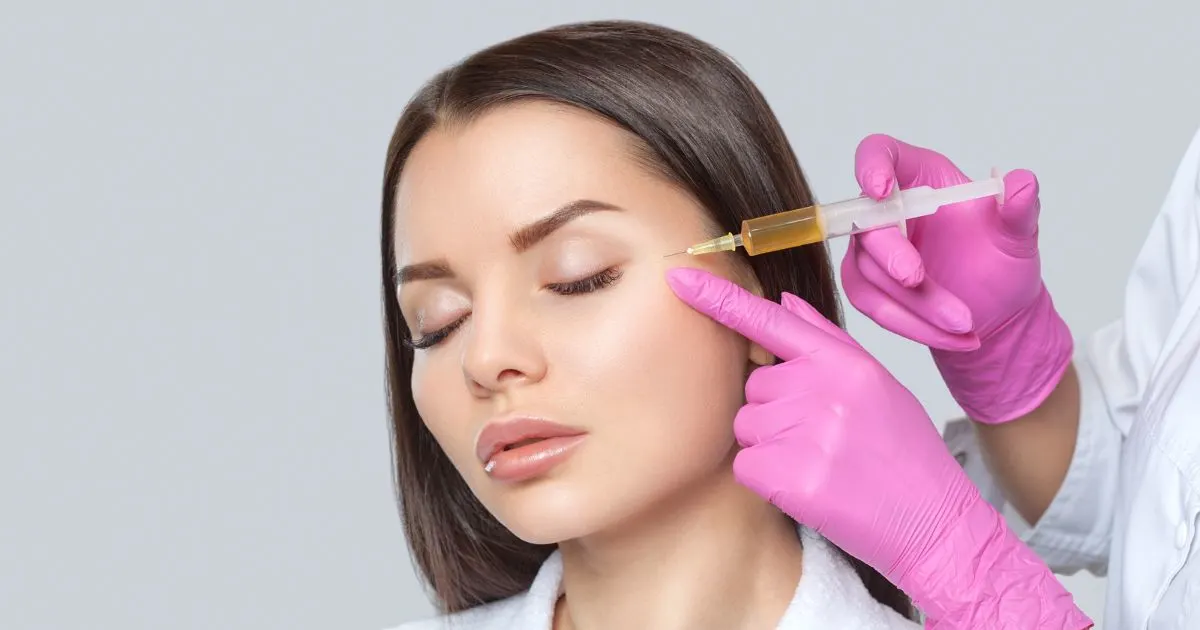 Close-up of a medical professional preparing PRP tubes for scar treatment using natural platelet therapy.
